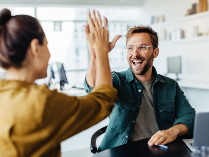 white man high fiving woman