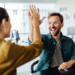 white man high fiving woman