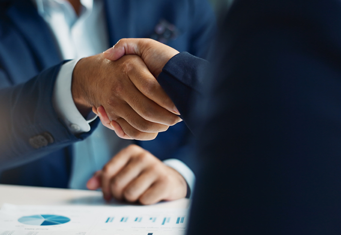 closeup of two professionals shaking hands