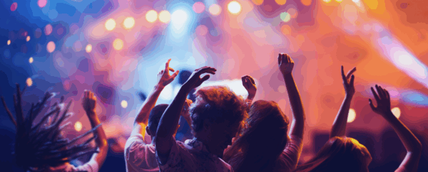 group of people dancing at a concert