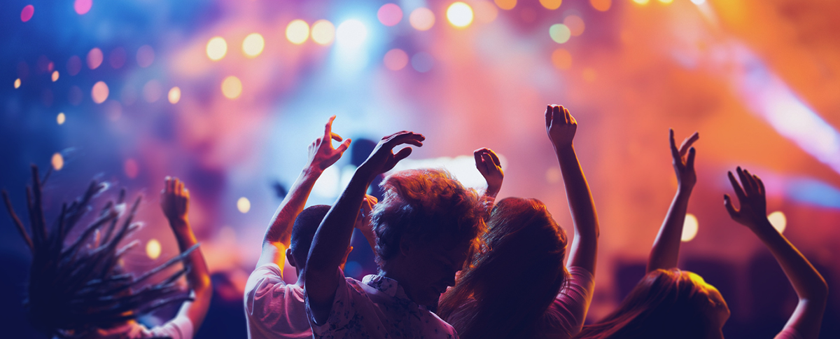 group of people dancing at a concert